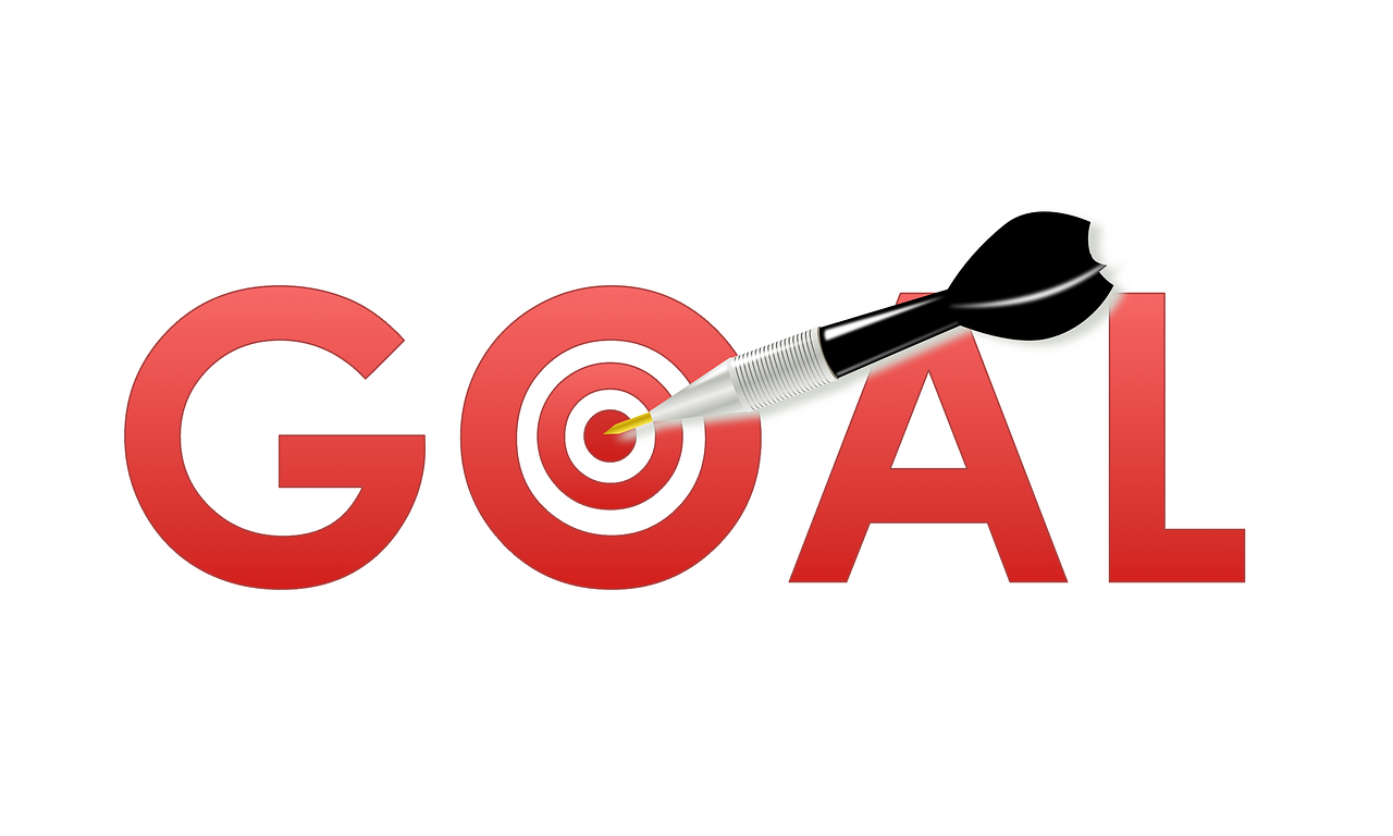 "The word 'GOAL' in bold red letters with a dart hitting the bullseye of a target symbol embedded in the letter 'O'."